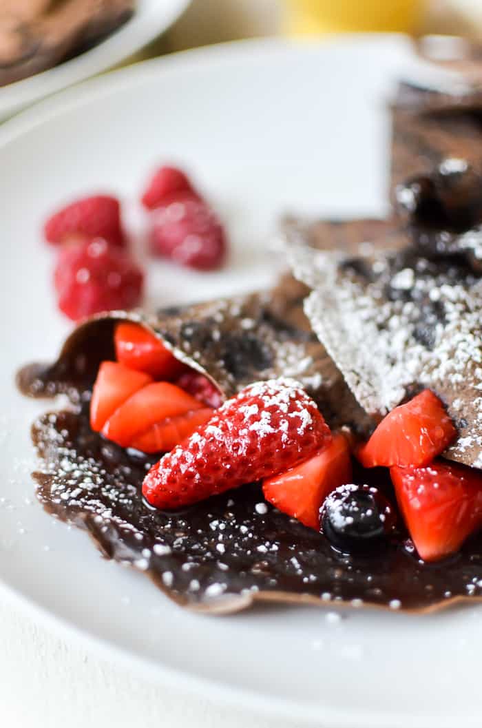 Chocolate crepes with berry compote