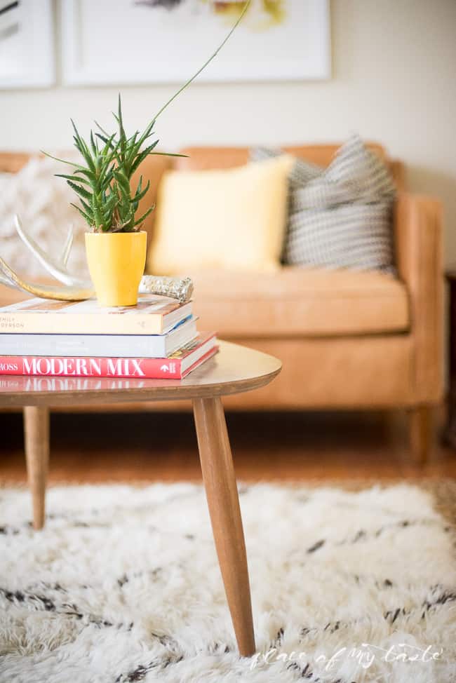 This fun and boho living room decor is great! You need to see the before picture! What a transformation from a messy playroom to a bright, boho living room!