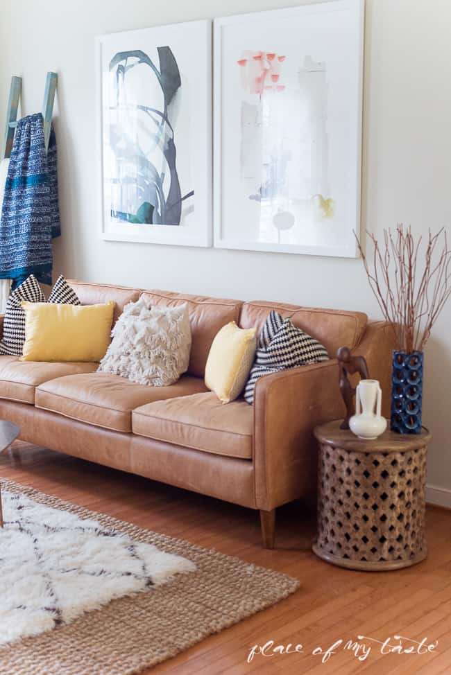 This fun and boho living room decor is great! You need to see the before picture! What a transformation from a messy playroom to a brigh, boho living room!