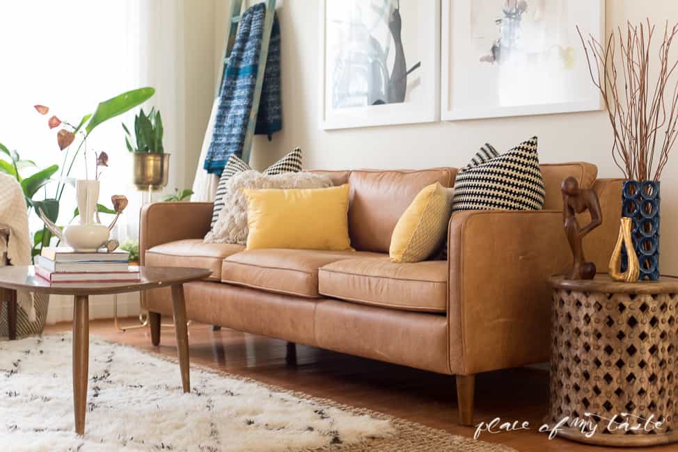 This fun and boho living room decor is great! You need to see the before picture! What a transformation from a messy playroom to a bright, boho living room!