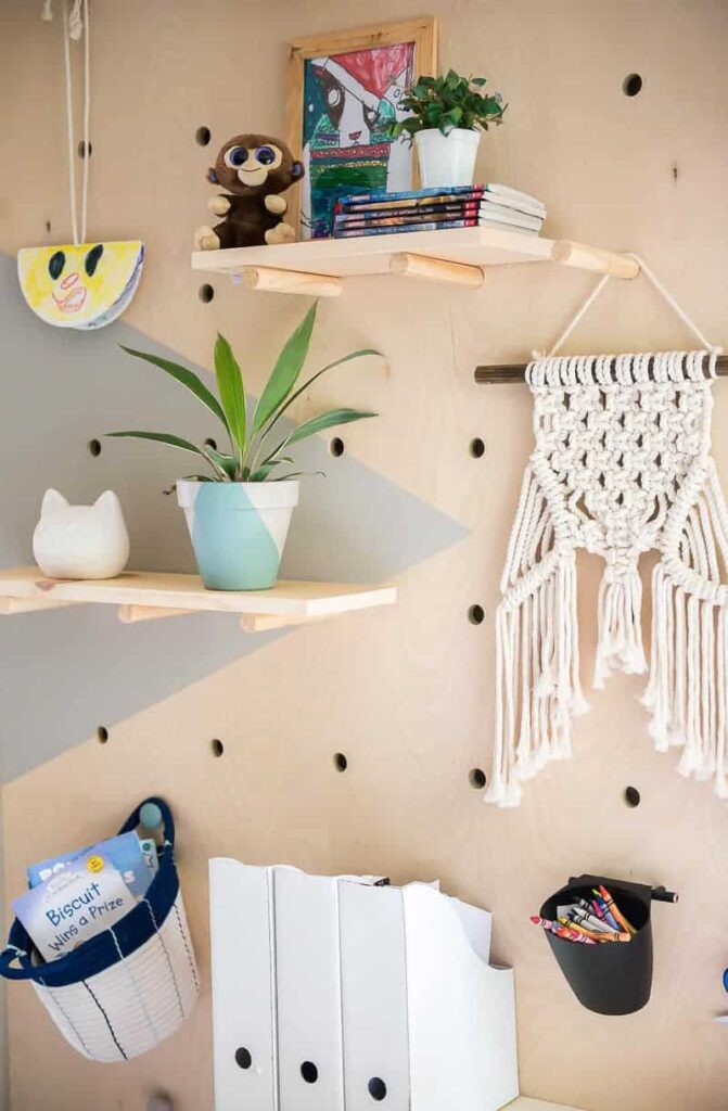 shelves hold books and photos and a macrame