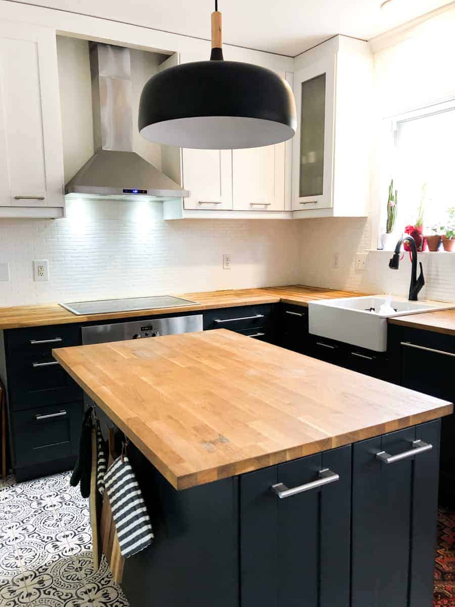 Beautiful two toned kitchen with butcher block countertops!