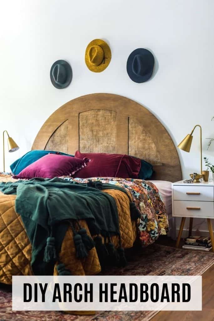 Beautiful moody bedroom featuring an arch headboard.