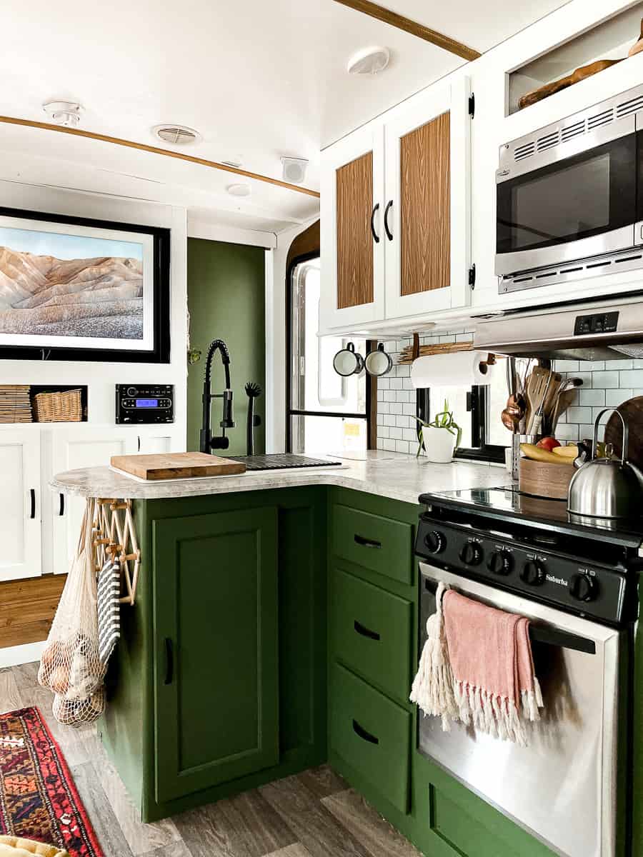 Green kitchen cabinets in camper.