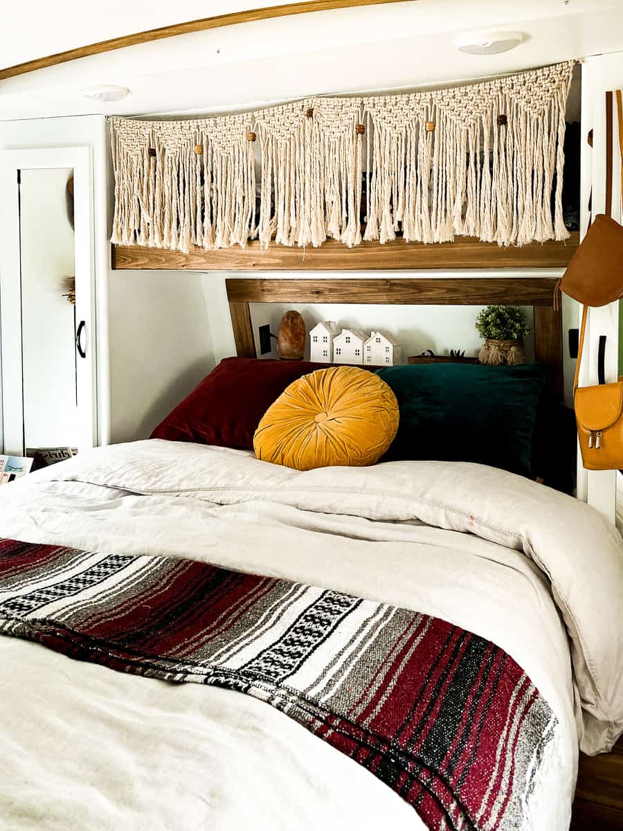 Boho camper bedroom with bold colors.