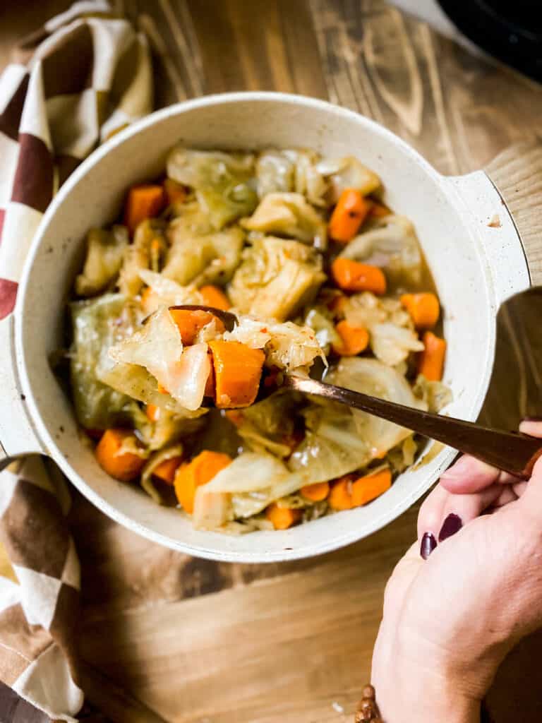 Spoon full of sautéed cabbage ad carrots